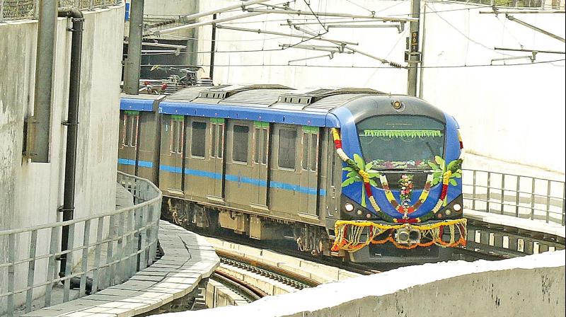 The underground metro rail chugs out of a tunnel from the Thirumangalam station on Sunday. (Photo: DC)