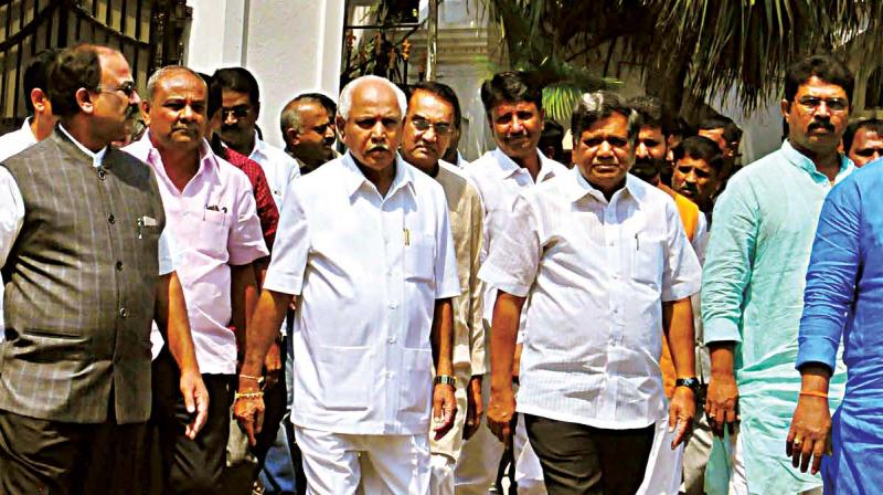 BJP leaders B.S. Yeddyurappa, Jagadish Shettar,  R. Ashok, S.R. Vishwanath,  and Aravind Limbavali on their way to the Raj Bhavan on Friday (Photo: KPN)