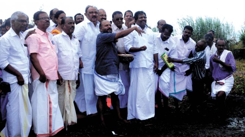 Agriculture minister V.S. Sunilkumar sows paddy seeds at Rani Kayal fields at Kuttnad in Alappuzha on Thursday.  arrangement