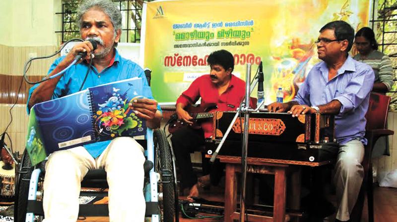 Vellapan, an inmate of the old-age home sings his favourite evergreen Malayalam songs for his companions at the Government Old-age home at Vellimadukunnu on Thursday.  (Photo: Akhin Dev)