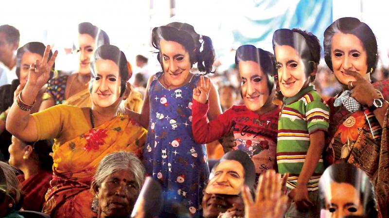 Congress workers seen wearing Indira Gandhi masks during the KPCC Sarthaka Samavesha at the National College Grounds in Bengaluru on Wednesday. (Photo: KPN)