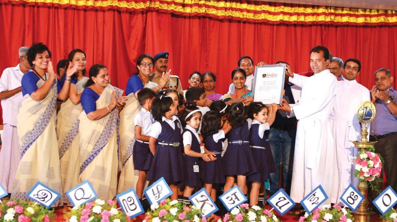 Teachers and students of Devamatha CMI School with the certificate of India Book of Records. (Photo: DC)