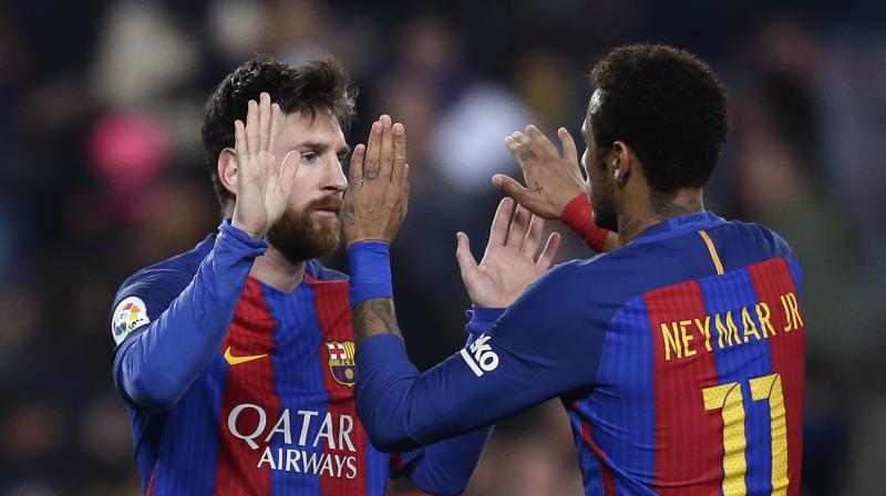 Lionel Messi and Neymar celebrate after scoring against Leganes. (Photo: AP)