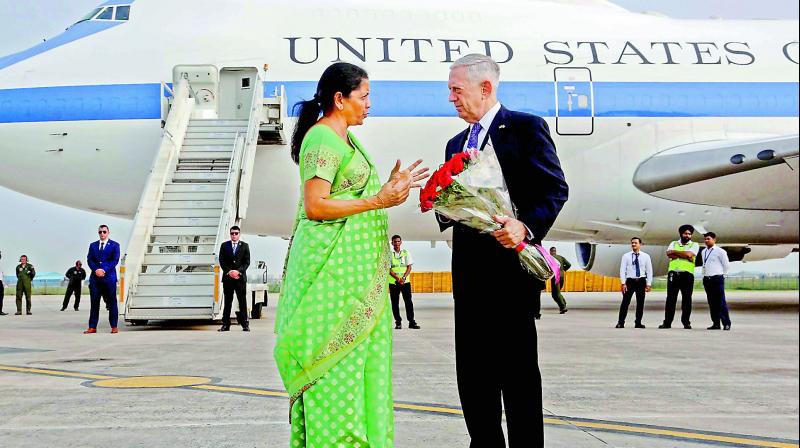 Defence minister Nirmala Sitharaman presents a bouquet to US Secretary of Defence James Mattis on his arrival at Palam Tech Area in New Delhi, Wednesday. (Photo:PTI)