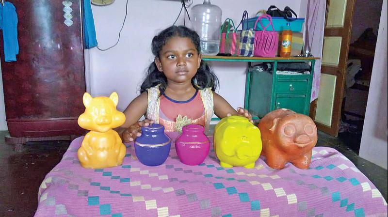 Anupriya, a Class 3 student, was filling her piggy banks to get herself a cycle. However, when news of Keraliites affected by the flood came, she decided to break her piggy banks to donate her savings to flood affected people. In appreciation of her kindness. (Photo:DC)