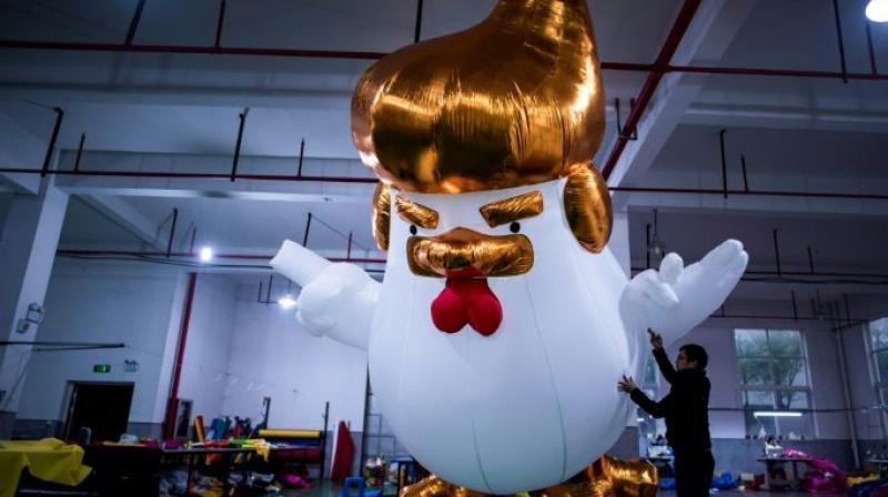 Yifang Inflatables, a factory in the city of Jiaxing, near Shanghai, began selling the inflatables after images of a large sculpture of a similar design outside a shopping center in the northern city of Taiyuan went viral on social media last month. (Photo: AFP)