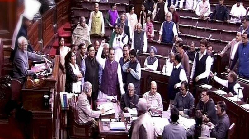 Opposition members protest in the Rajya Sabha in New Delhi (Photo: PTI)