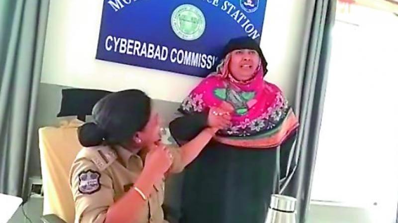 Noor Jahan Begum seen crying at the news of transfer of Moinabad police station inspector S. Sunitha in this image grab from a video