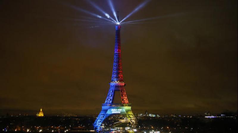 The Eiffel Tower is lit with colors for the Paris 2024 during the launch of the international campaign of Paris as candidate for the 2024 Olympic summer games in Paris. (Photo: AP)